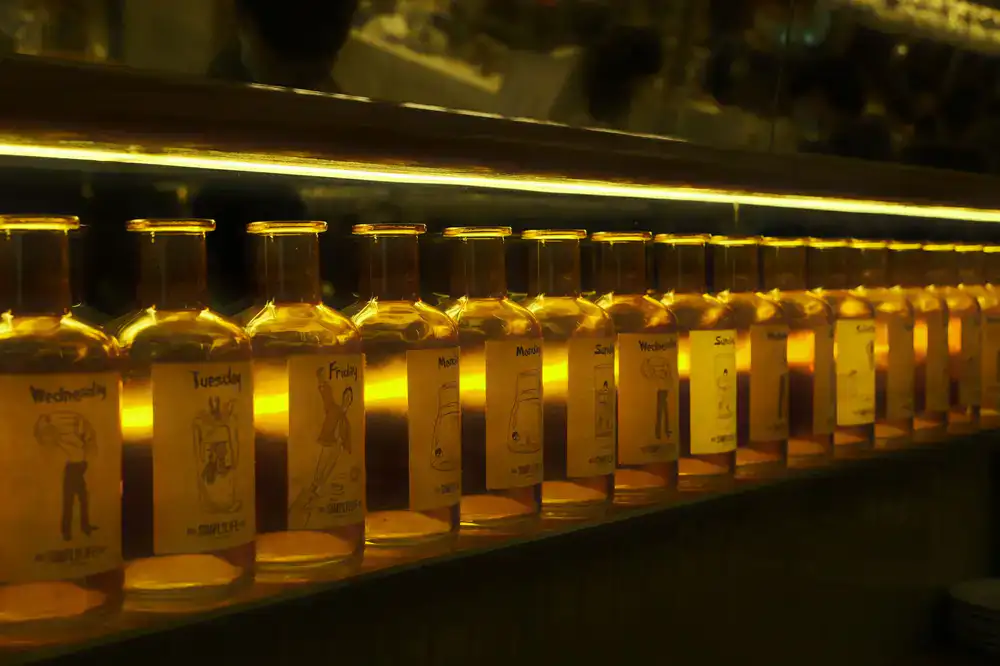Row of filled jars with handwritten labels