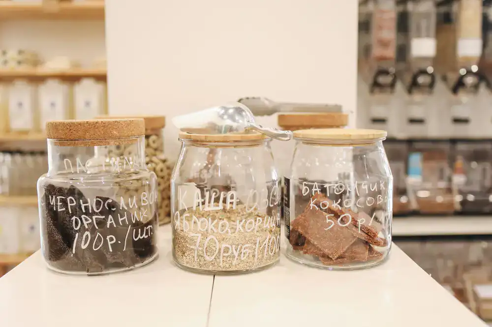 Details of the shop counter with natural grains in glass jars